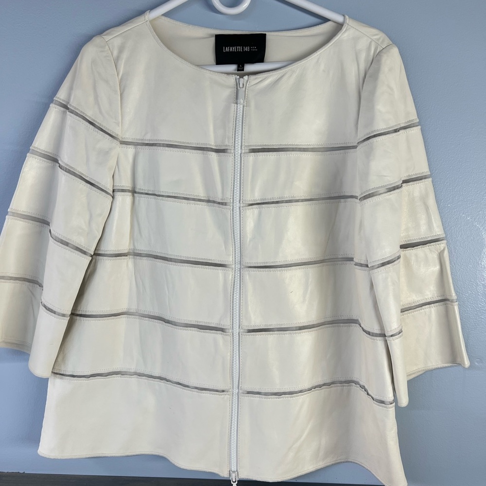 This is a lightly used Lafayette 148 white leather jacket.